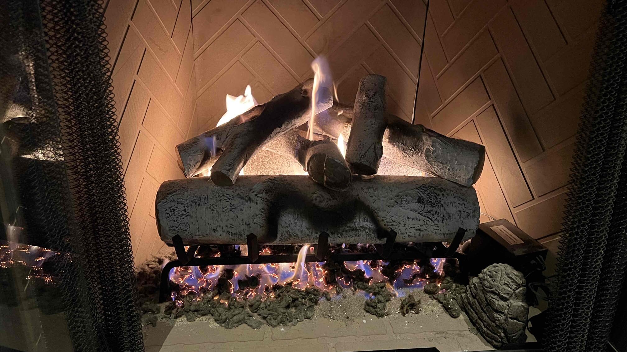 wood-burning fireplace burning fire before fireplace cleaning Los Angeles 